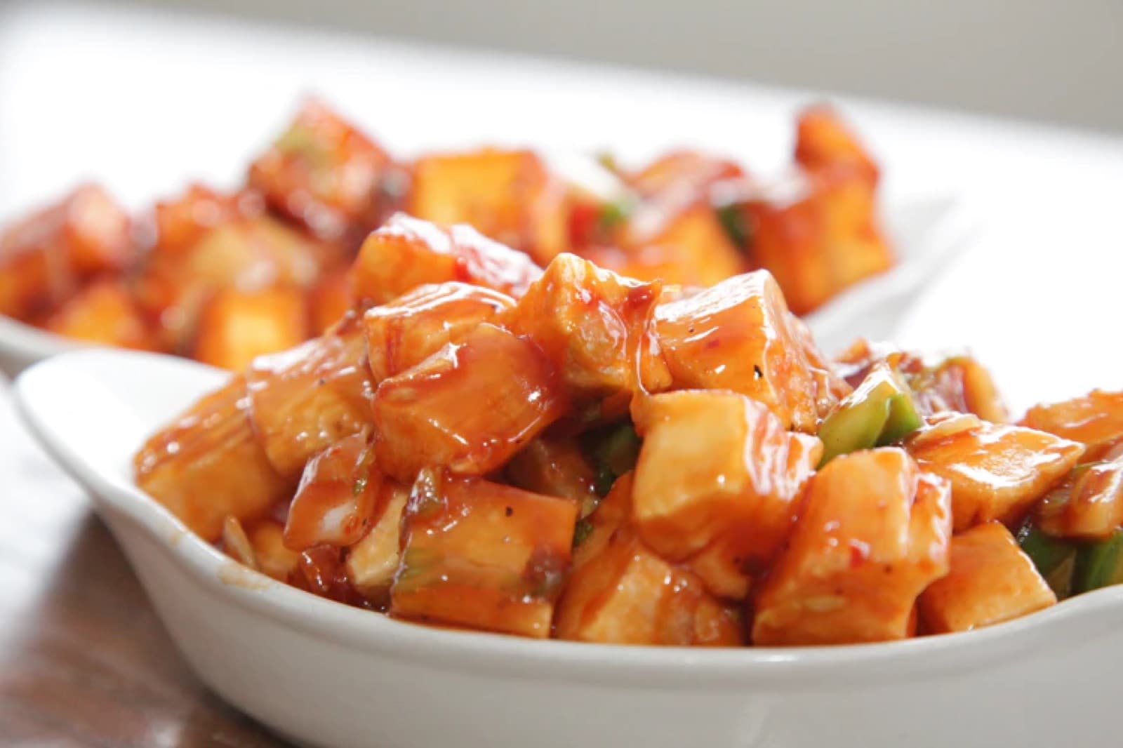 A bowl of chilli paneer, a high-fat, low-carb dish.
